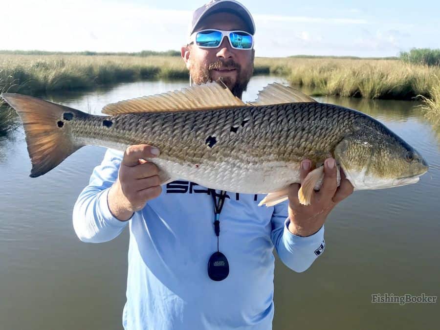 man holding a fish