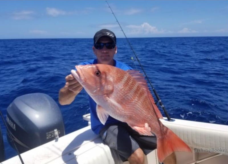 man holding a fish