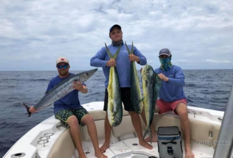 fishing photo of three guys with nice fish