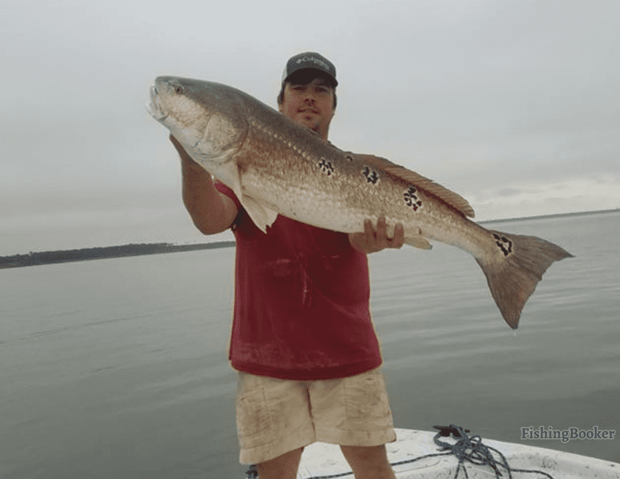 man holding a fish