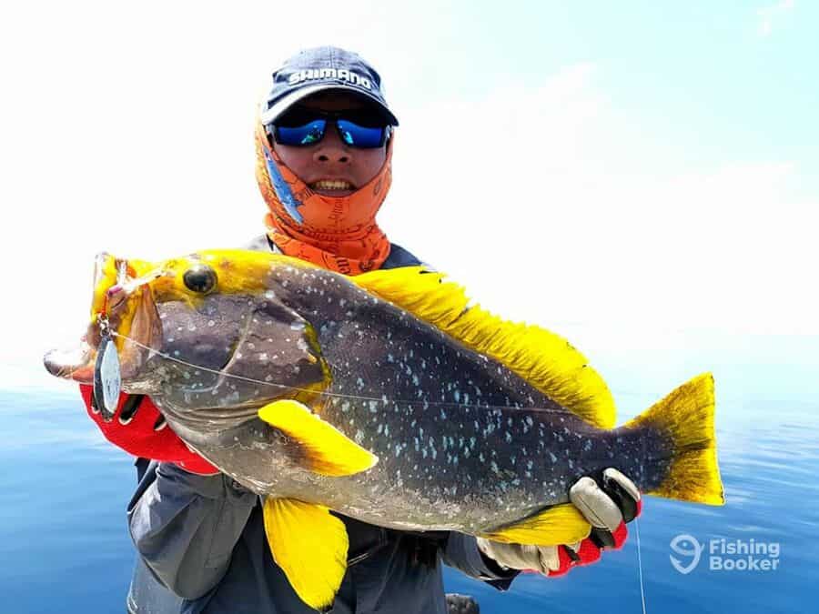 man holding a fish