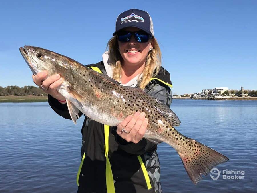 woman holding a fish